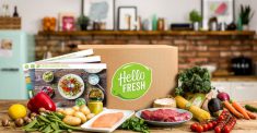 Hello Fresh box on table of fresh food and meat with recipes. Home delivery services